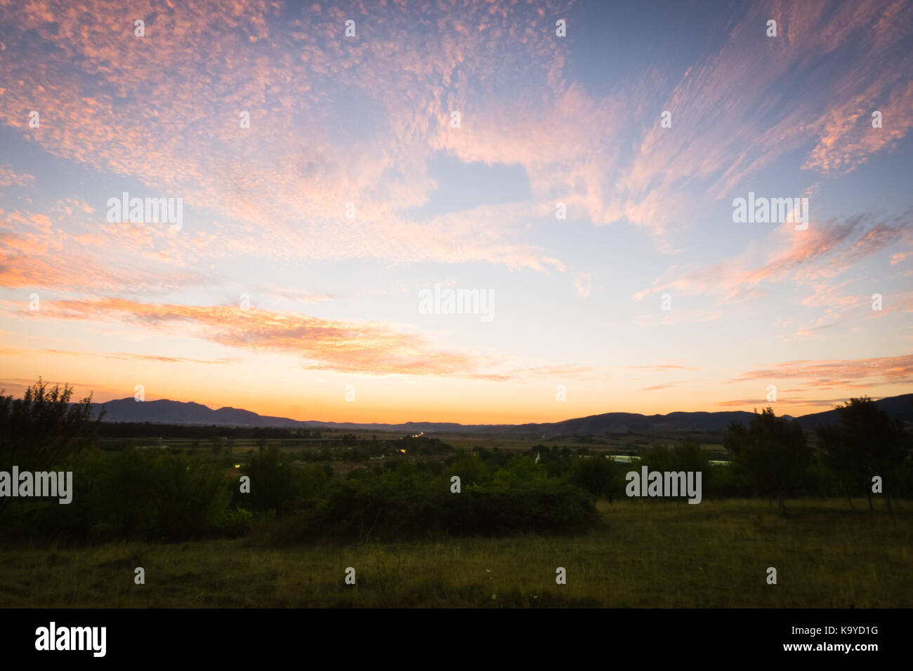 Sunset with orange clouds landscape Stock Photo - Alamy