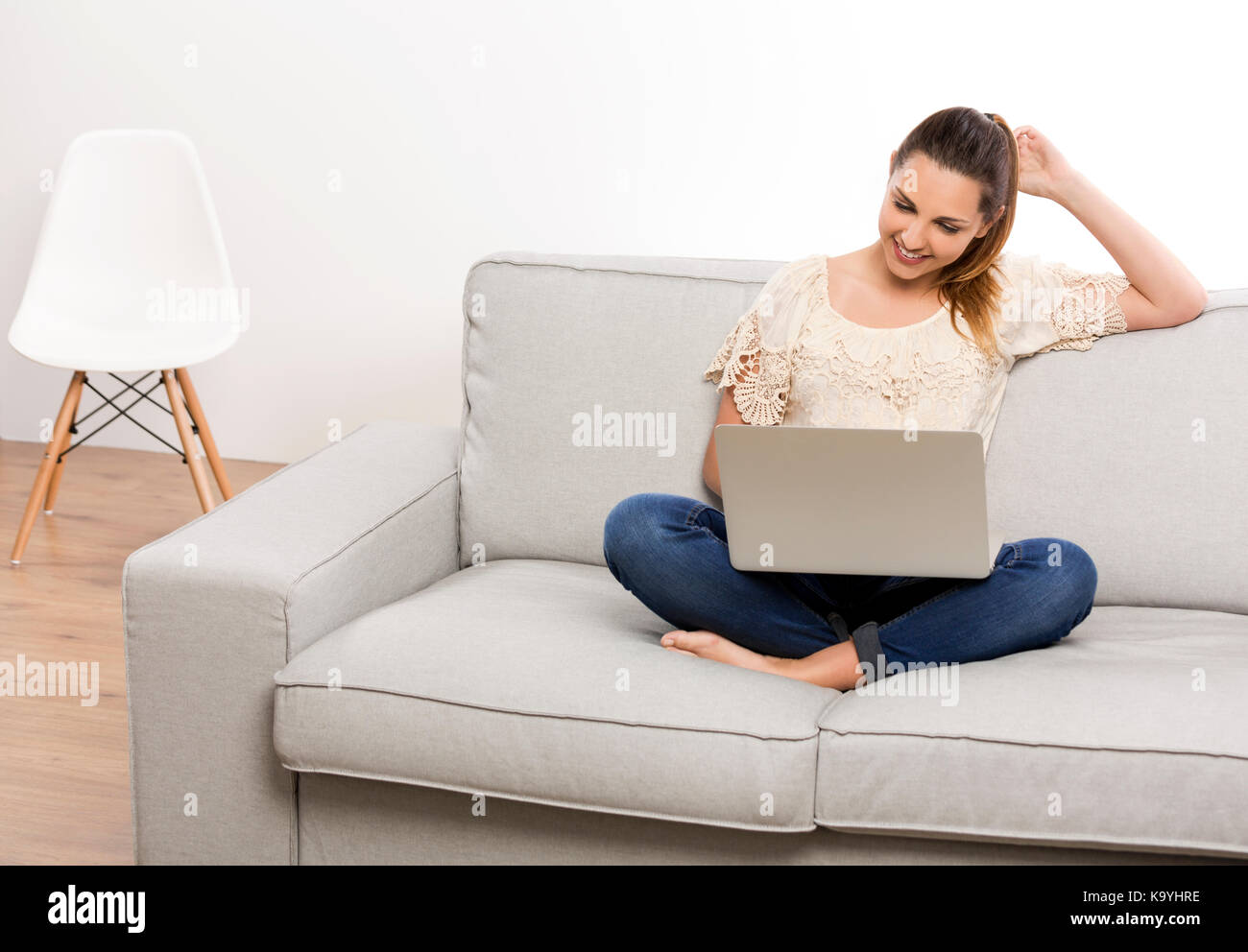 Beautiful woman at home working on her laptop Stock Photo - Alamy