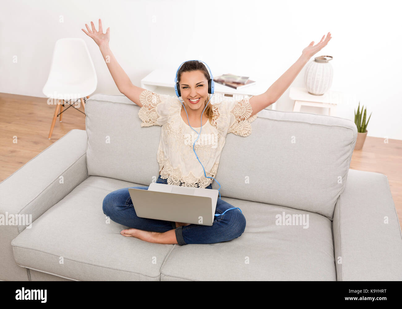 Beautiful woman at home working on her laptop and listen music Stock ...