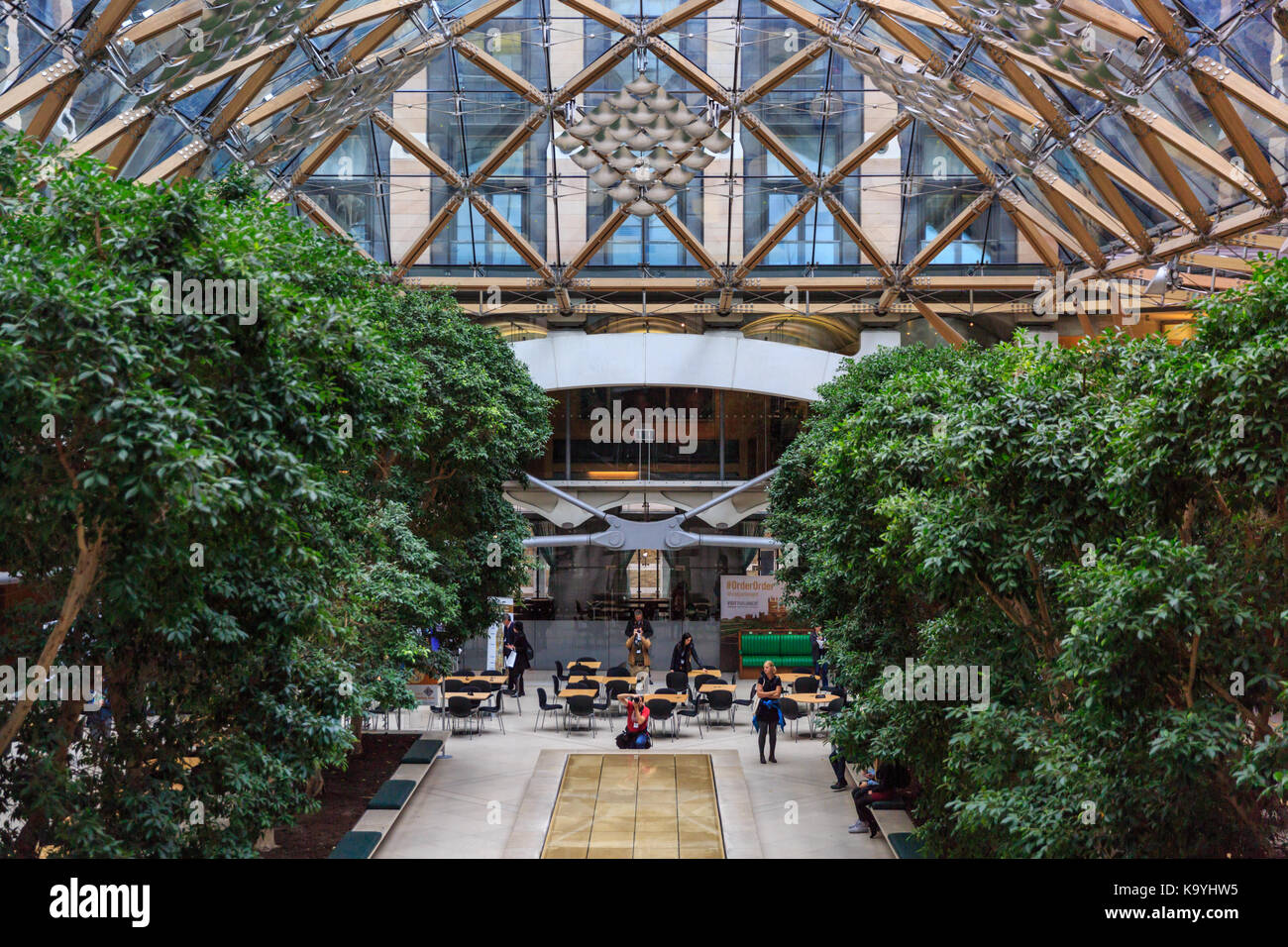 The glass roof structure and atrium at Portcullis House, Westminster, London England UK Stock Photo