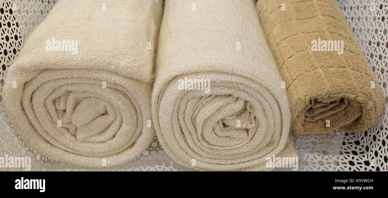 https://c8.alamy.com/comp/K9YWCH/hygiene-concept-rolled-up-white-and-brown-terry-or-cotton-bath-towels-K9YWCH.jpg