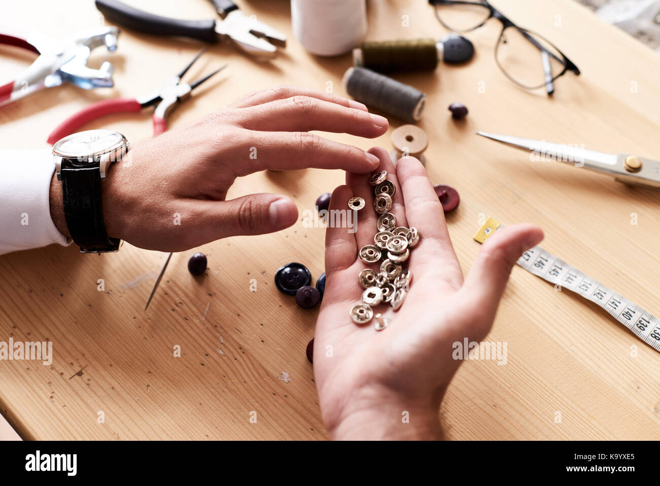 male hands with tailor measuring tape isolated 12570441 Stock