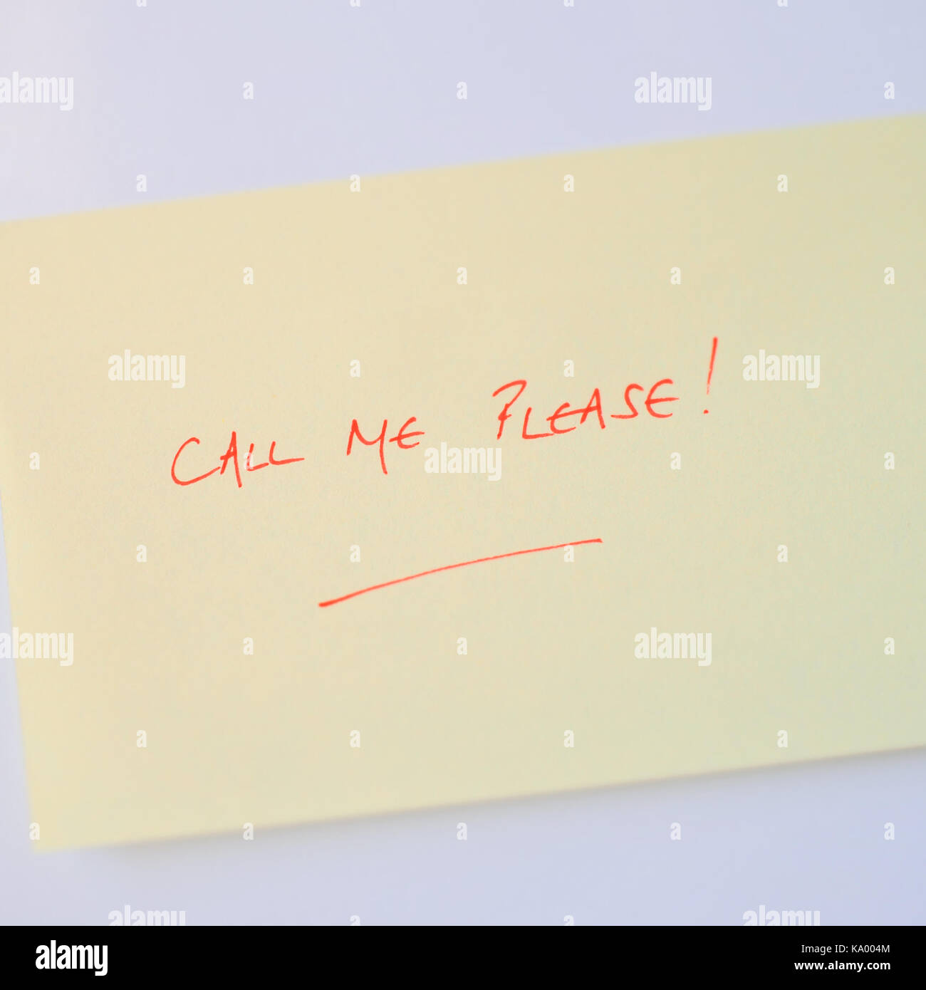 POST IT NOTE WITH CALL ME PLEASE, STICKIES Stock Photo