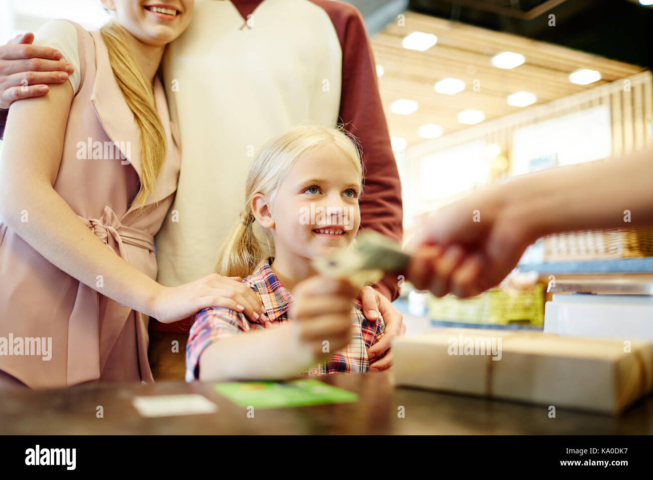 Giving cash to seller Stock Photo Alamy