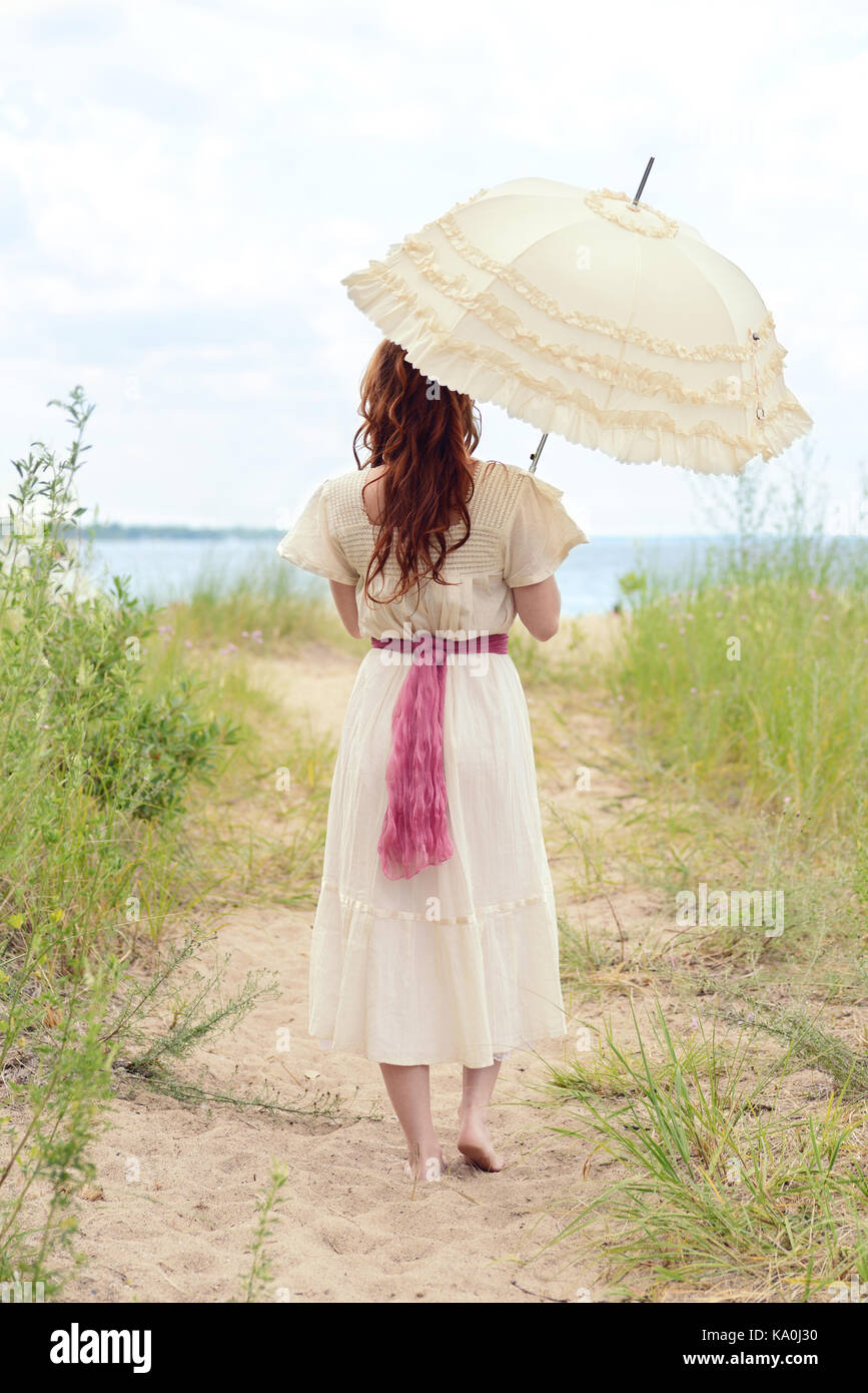 vintage woman with parasol at the beach Stock Photo - Alamy