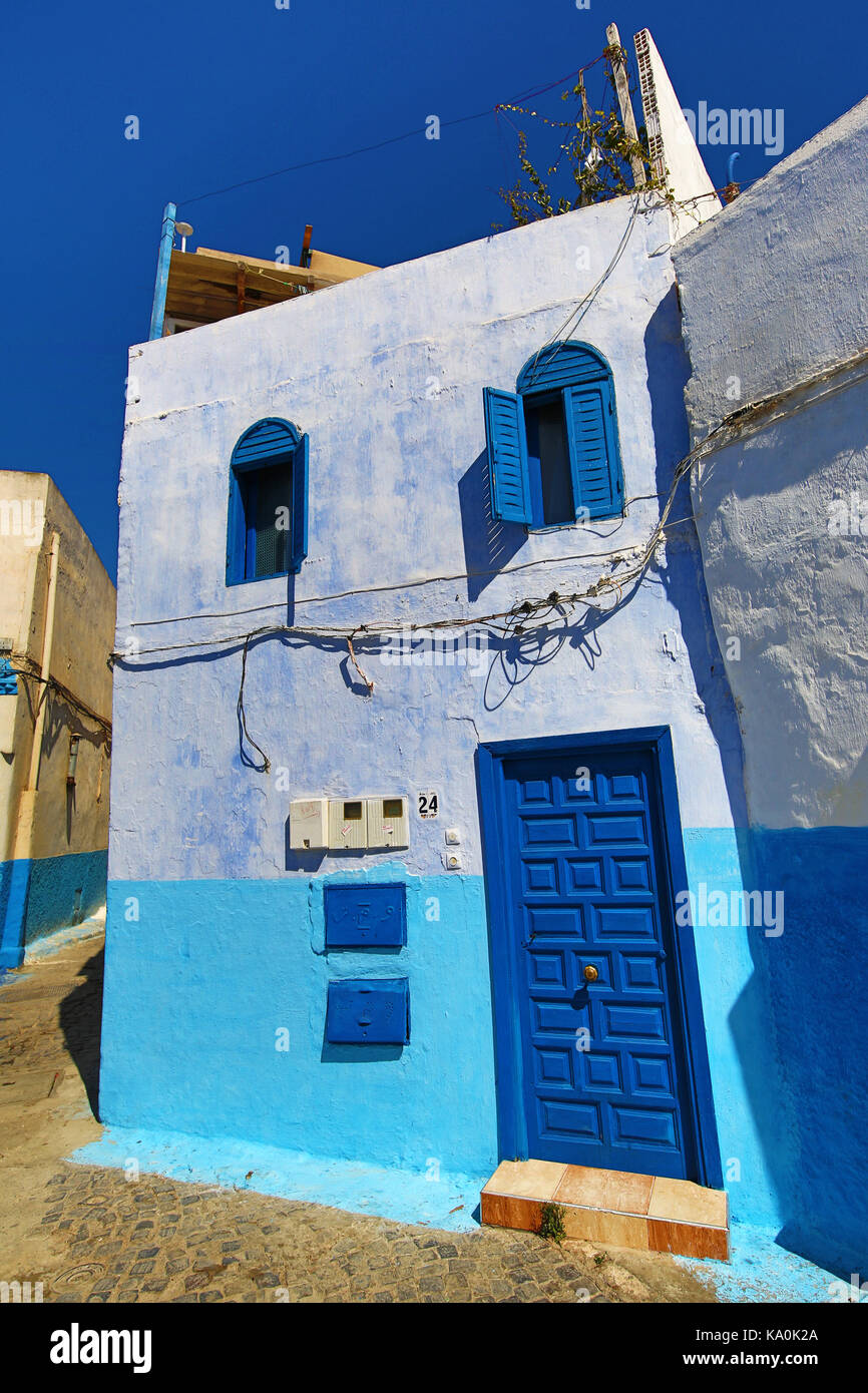 Blue and white walls of streets of buildings in the Kasbah of the Udayas in  Rabat, Morocco Stock Photo