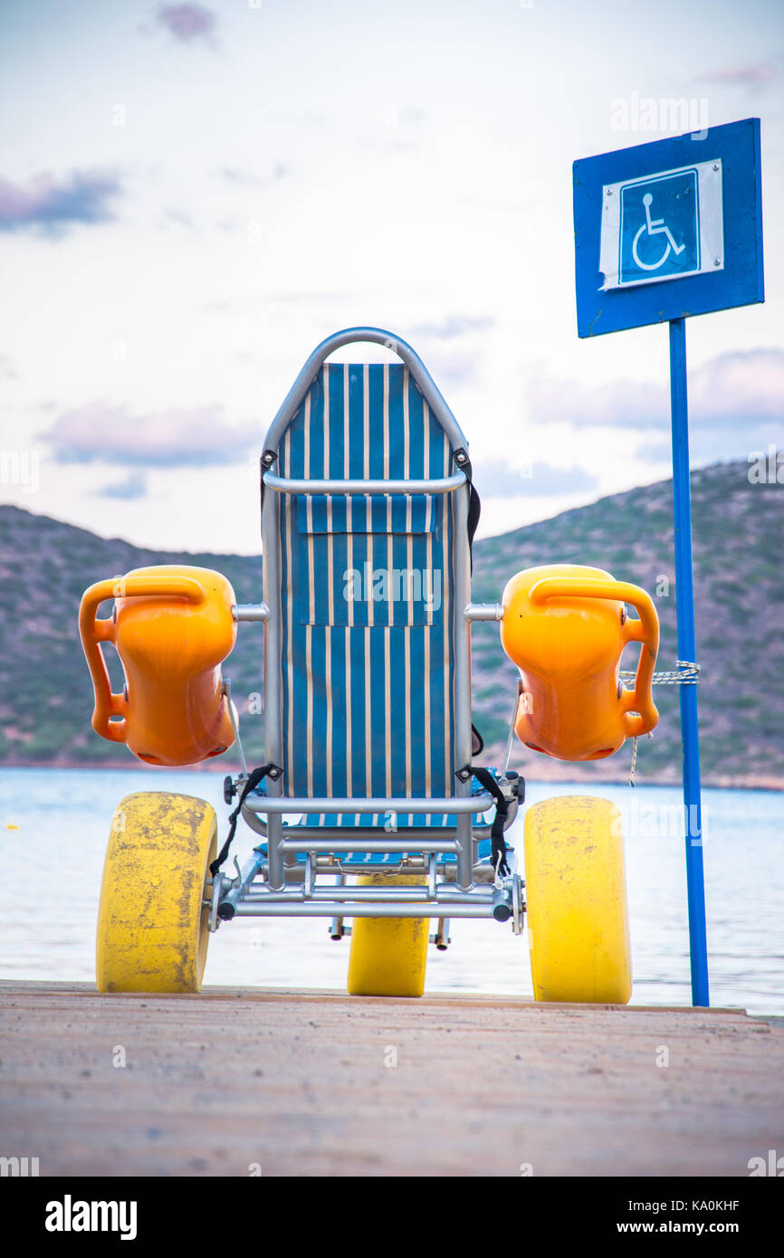 Beach wheel chair for disabled swimmers Stock Photo Alamy