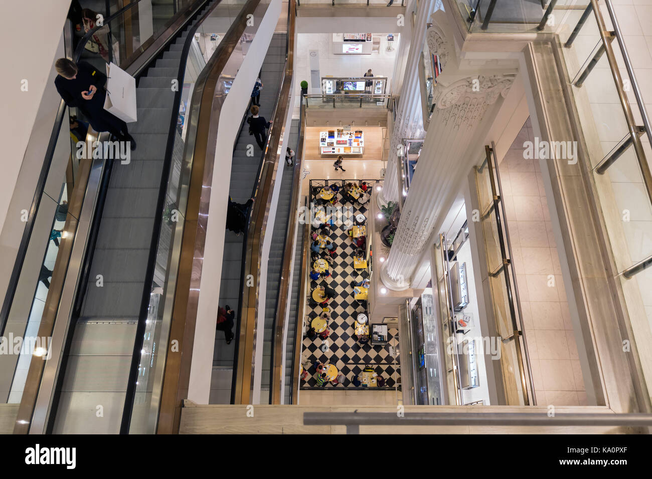 LONDON, ENGLAND - JUNE 09, 2017: Stairwell with shopping people in famous Selfridges department store London Stock Photo