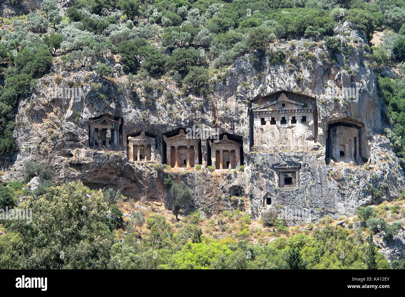 The ancient Lycian Rock Tombs, Turkey, temple style carved into the rock cliffs 400 BC Stock Photo