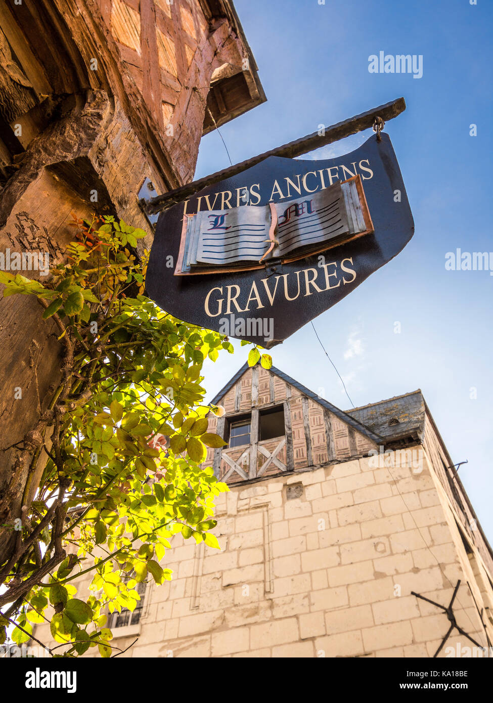 Hanging shop sign for old books and engravings - Chinon, France. Stock Photo
