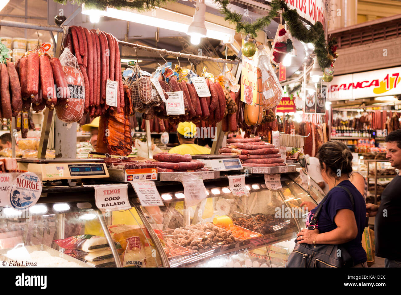 Brazilian Public market stand selling all sort of beef, pork meat, sausages, chicken parts and many more groceries Stock Photo