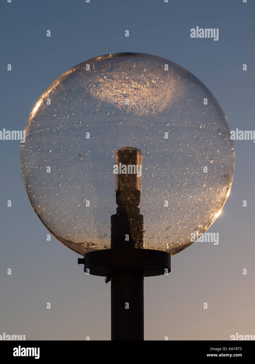 Lamp house against the blue sky, coloured by the setting sun in Knivsta, South of Uppsala