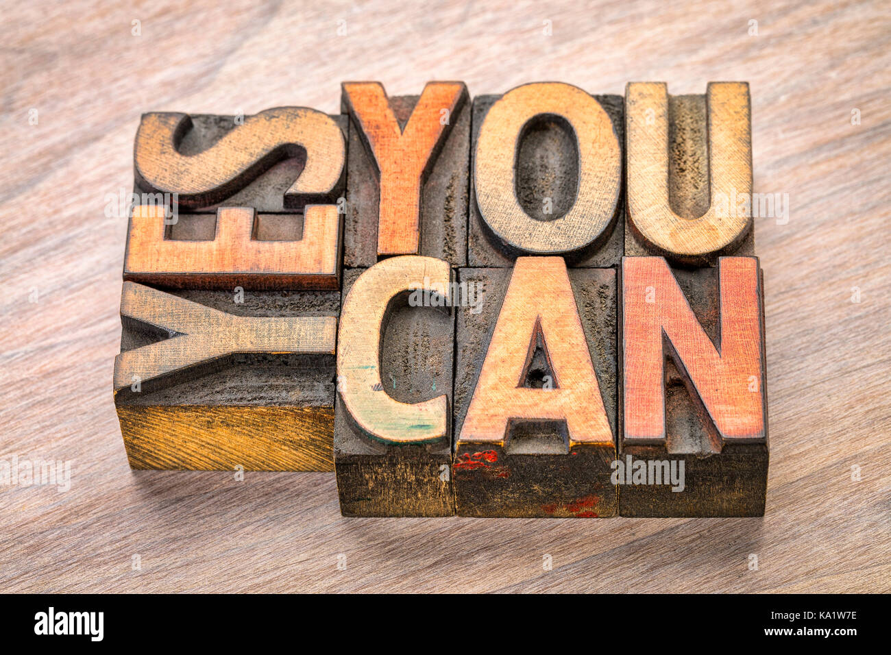 yes, you can - motivational word abstract in vintage letterpress wood type blocks Stock Photo
