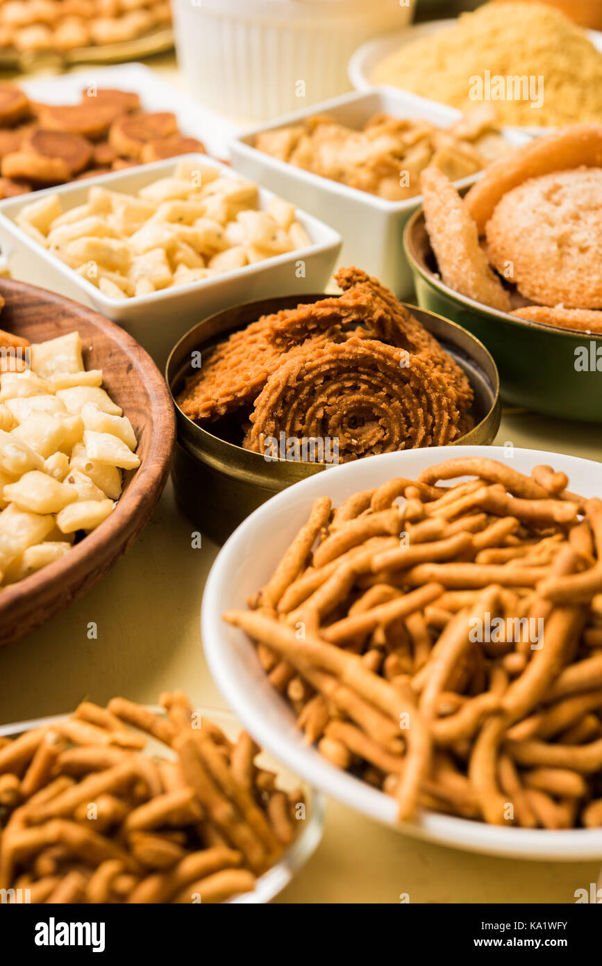 stock photo of  Diwali food or Diwali snacks or Diwali sweets like anarsa, bakarvadi, chakli, sev, bhujiya, shankar pale and chivda or chiwada, karanj Stock Photo