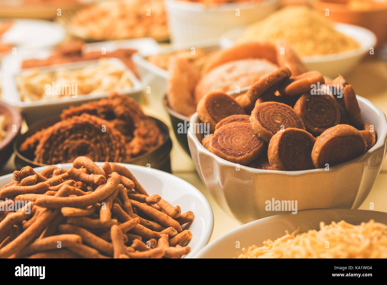 stock photo of  Diwali food or Diwali snacks or Diwali sweets like anarsa, bakarvadi, chakli, sev, bhujiya, shankar pale and chivda or chiwada, karanj Stock Photo