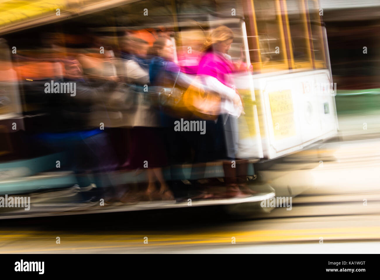 Blurred motion of passengers riding a cable car, San Francisco, California Stock Photo