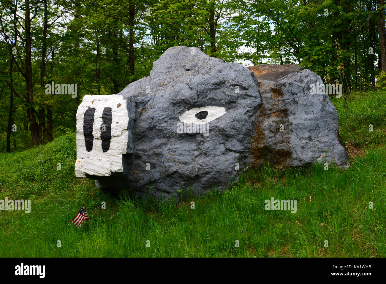 Large rock painted to look like a pig along Route 30 in the Adirondack Park, NY in summer. Stock Photo