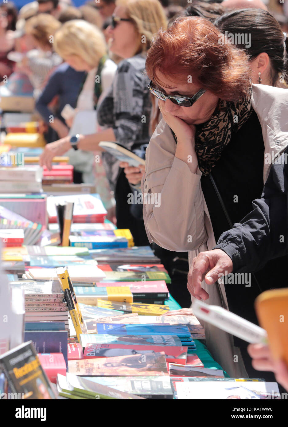 Books and buyers on a Street Books day in the island of Mallorca Stock Photo