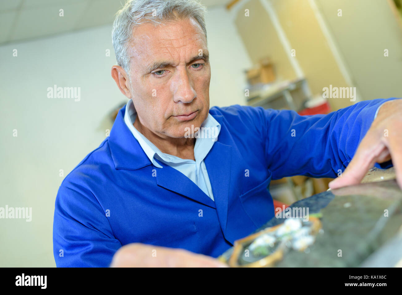 senior mechanic in car repair shop Stock Photo Alamy