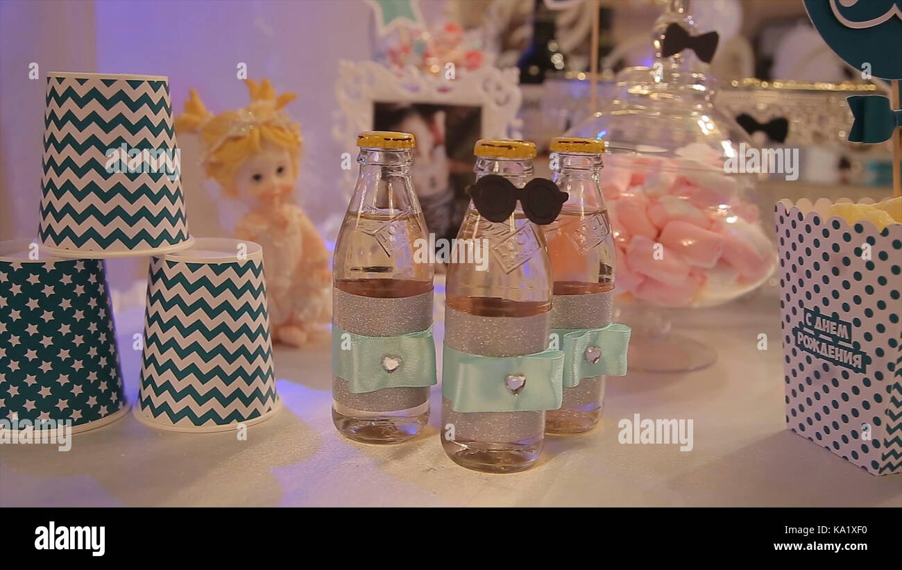 different bottles of juice on the table. Bottled drinks for guests at