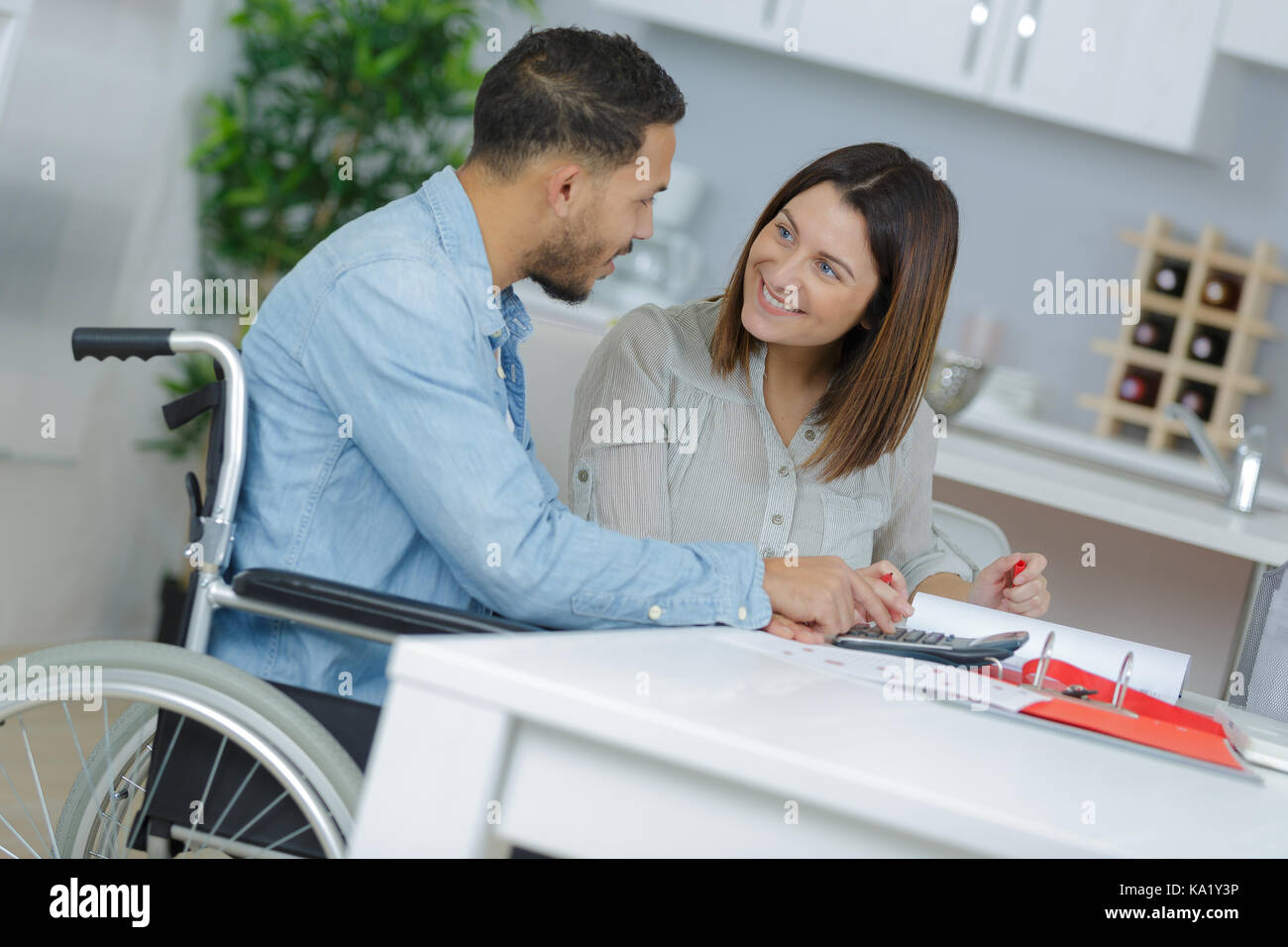 loving girl with her boyfriend in wheelchair Stock Photo - Alamy