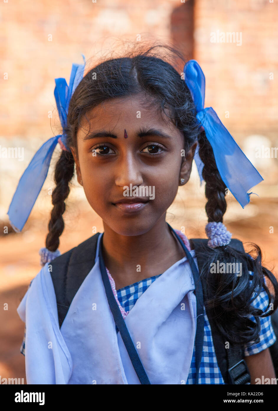 Rural residents in daily life. Little girl in school uniform. The girl had  a traditional Tikka on the forehead and children eye makeup and lips Stock  Photo - Alamy