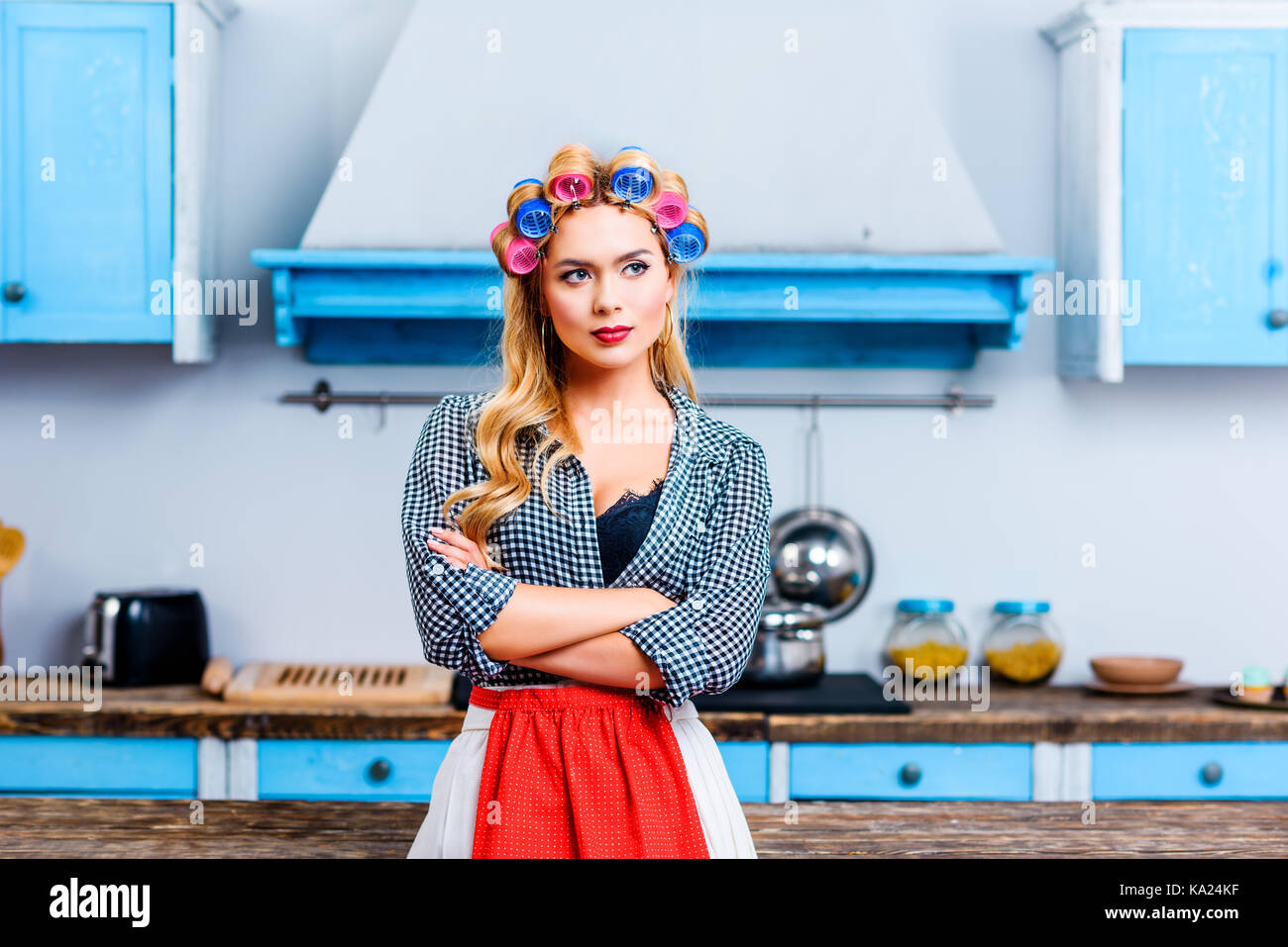 housewife with crossed arms Stock Photo