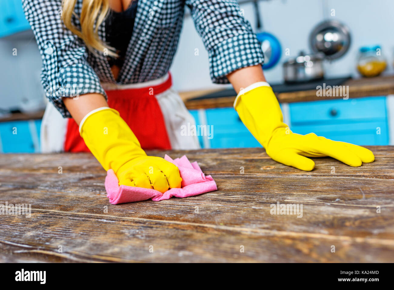 housewife cleaning tabletop Stock Photo