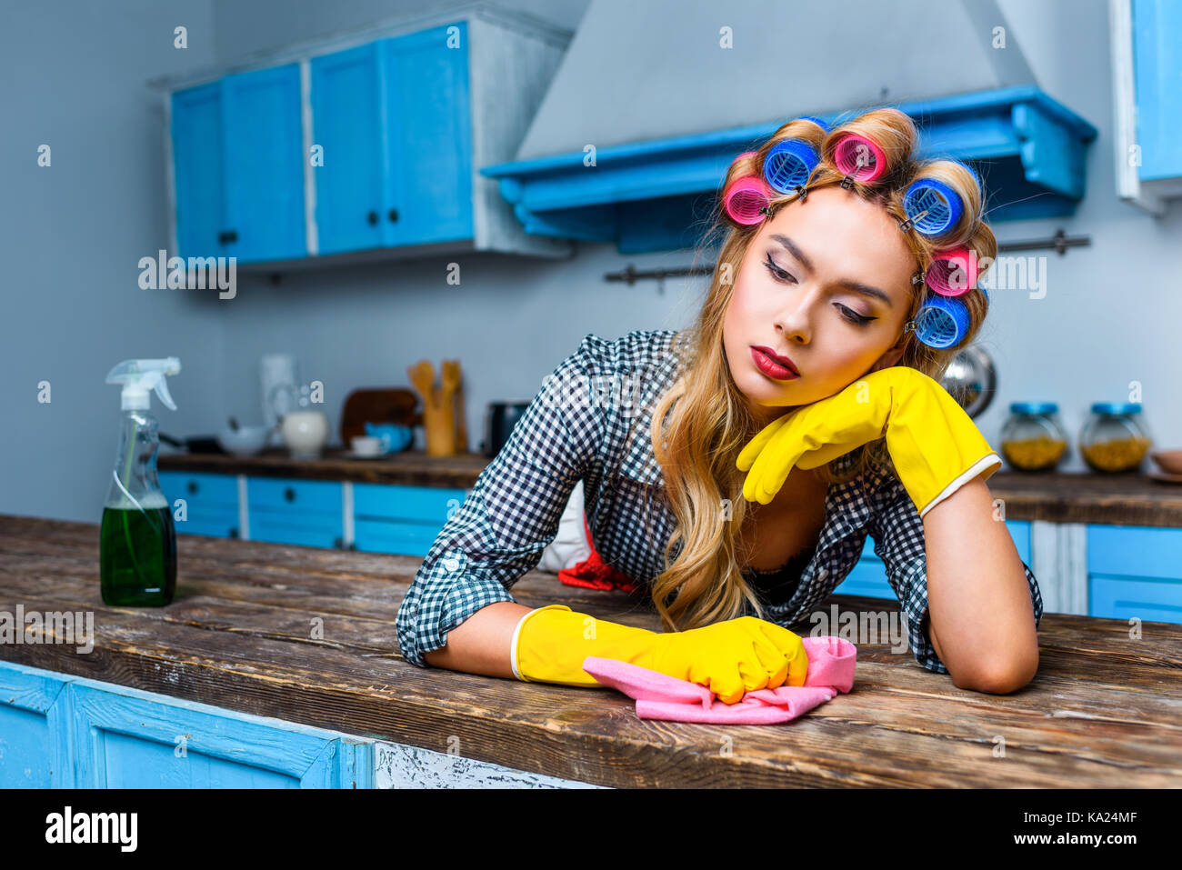 housewife cleaning tabletop Stock Photo