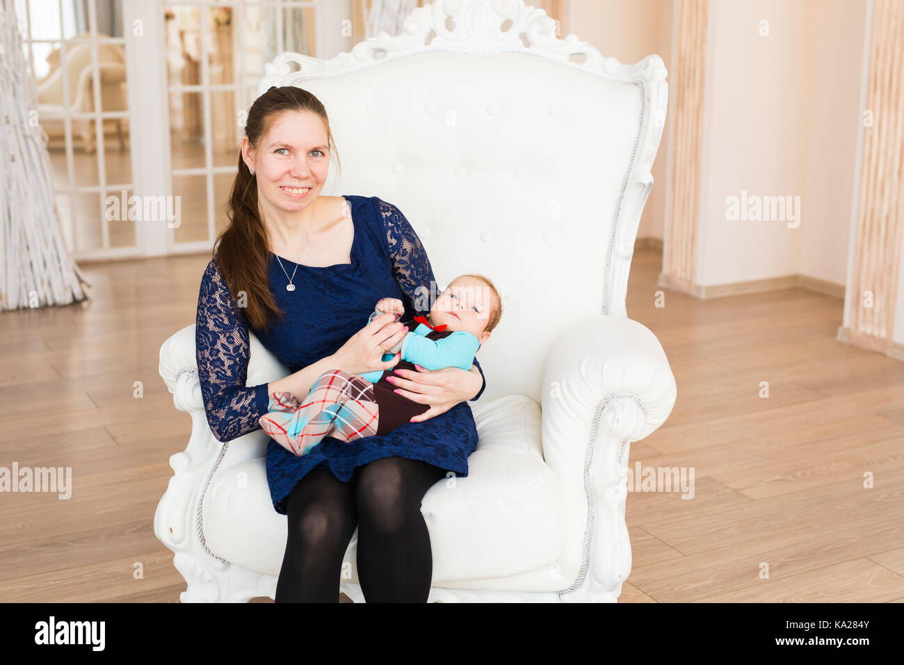 bright portrait of adorable baby boy and his mother Stock Photo - Alamy
