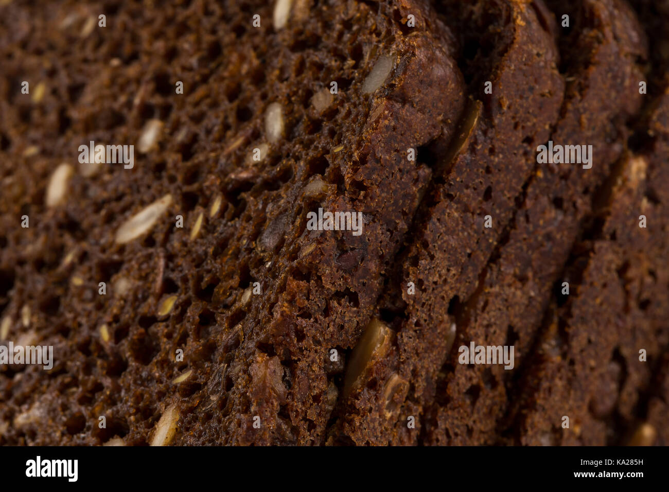 Dark rye bread with sunflower seeds background Stock Photo Alamy