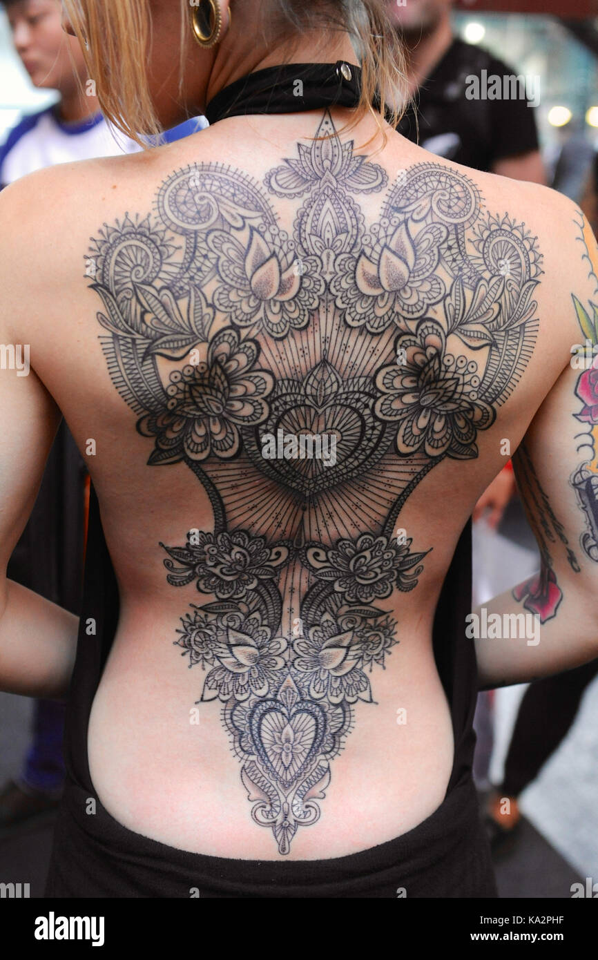 London, UK. 24th September, 2017. A man with a Japanese style body suit  tattoo, before shading and colouring has been completed, at the 13th London  International Tattoo Convention, which took place over