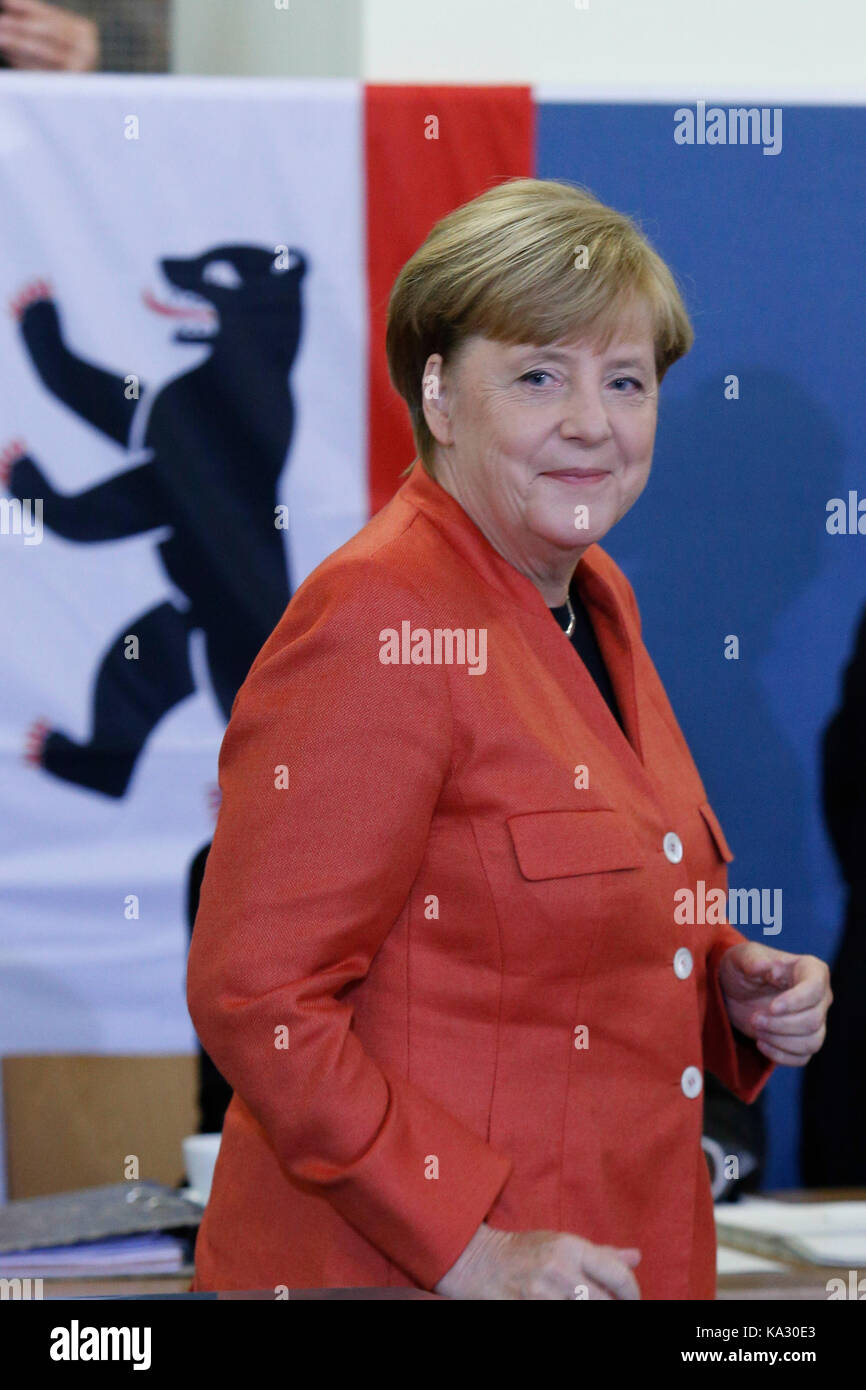 Berlin, Germany. 24th September, 2017. Chancellor Angela Merkel places a vote in general election for German Bundestag on September 24, 2014. She attended with her husband. Angela Merkel hopes to win the election and serve another term as Chancellor of the most powerful country in European Union. Credit: Dominika Zarzycka/Alamy Live News Stock Photo
