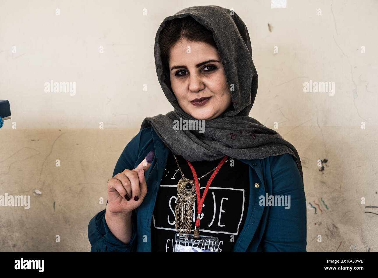 Erbil, Iraq. 24th Sep, 2017. Proudly displaying an ink covered finger