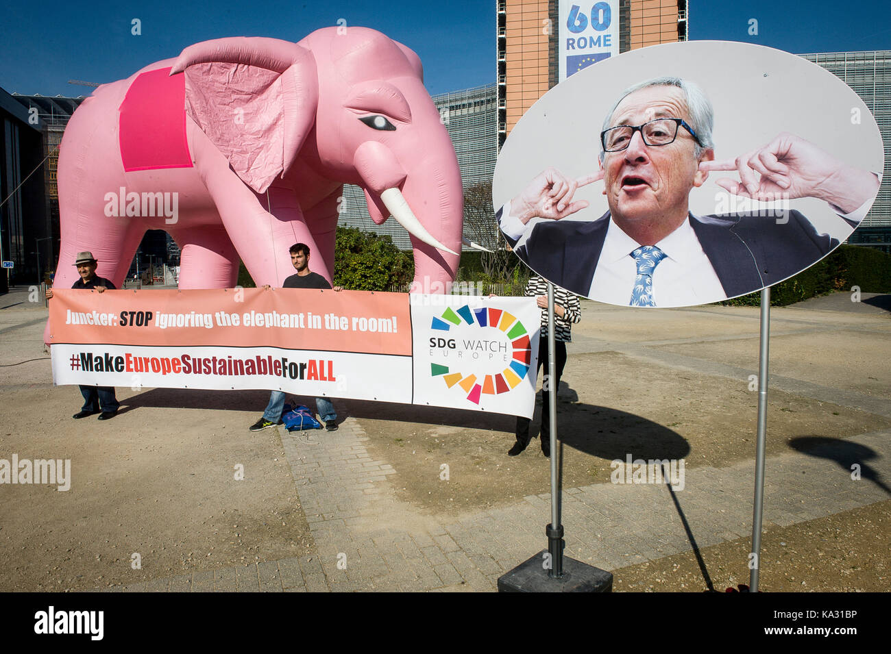 A massive inflatable elephant is seen in front of European Commission headquarters in Brussels, Belgium on 25.09.2017 SDG Watch protest at European quarters of Brussels to remind President Jean Claude Juncker, that he cannot continue to ignore sustainability. The protestors hold a banner with an inscription : 'Juncker stop ignoring elephant in the room' by Wiktor Dabkowski | usage worldwide Stock Photo