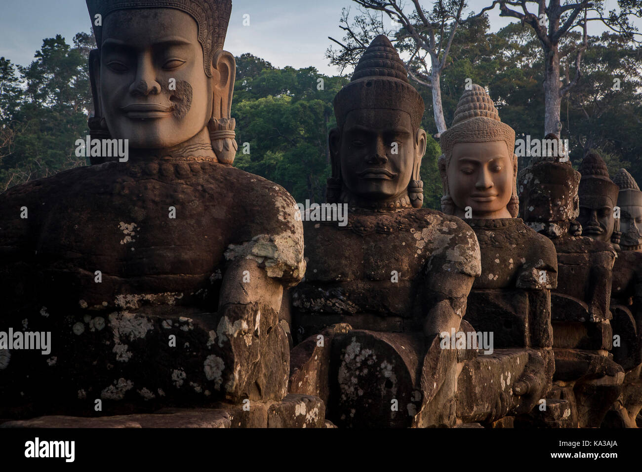 Detail, statues of Asuras on bridge of South Gate, in Angkor Thom, Siem ...