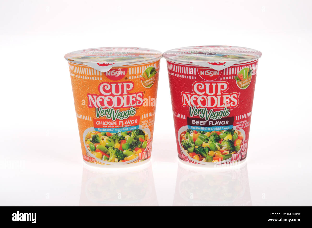 Unopened containers of Nissin Cup Noodles Very Veggie chicken flavor and beef flavor on white background, isolated USA. Stock Photo