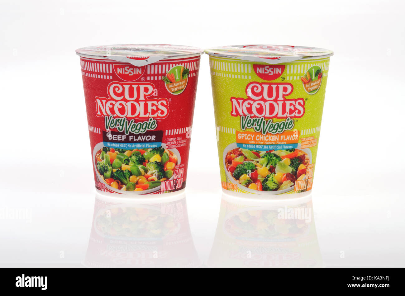 Unopened Nissin Cup of Noodles Very Veggie Beef flavor and spicy chicken flavor soups on white background isolate USA. Stock Photo