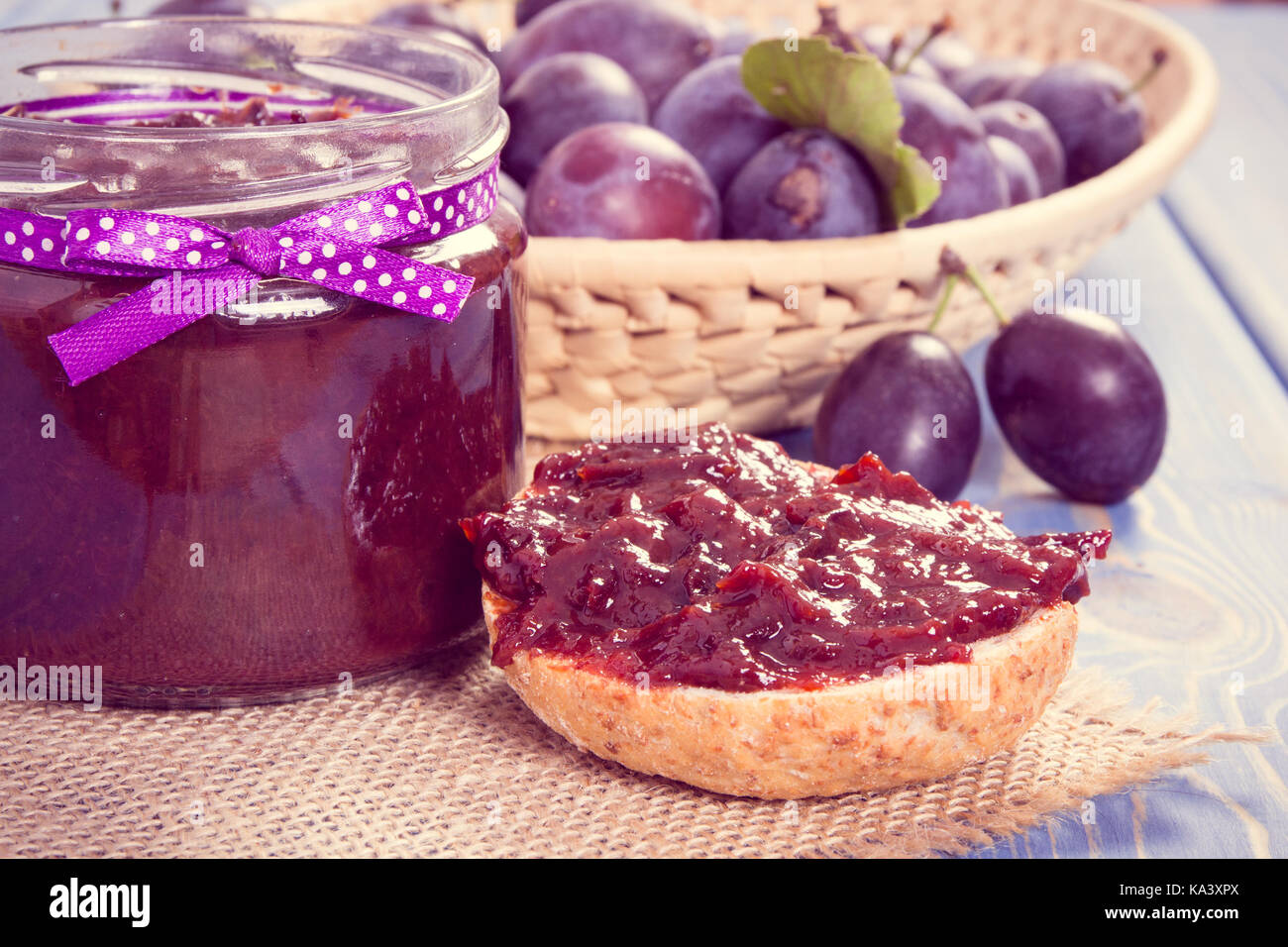 Vintage photo, Fresh prepared sandwiches with plum marmalade or jam, concept of healthy sweet snack, breakfast or dessert Stock Photo