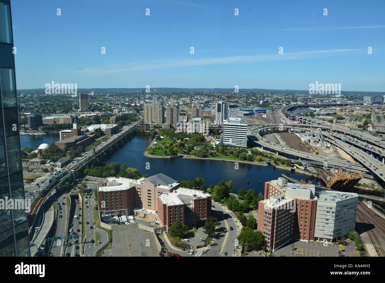 The Bunker Hill Memorial Leonard P. Zakim bridge in Boston, and points North seen from atop of a skyscraper in the West End on a sunny day. Stock Photo