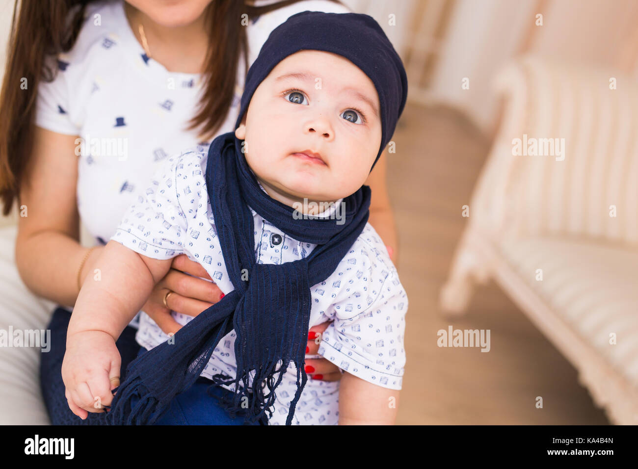 Portrait of cute baby boy wearing blue hat Stock Photo - Alamy