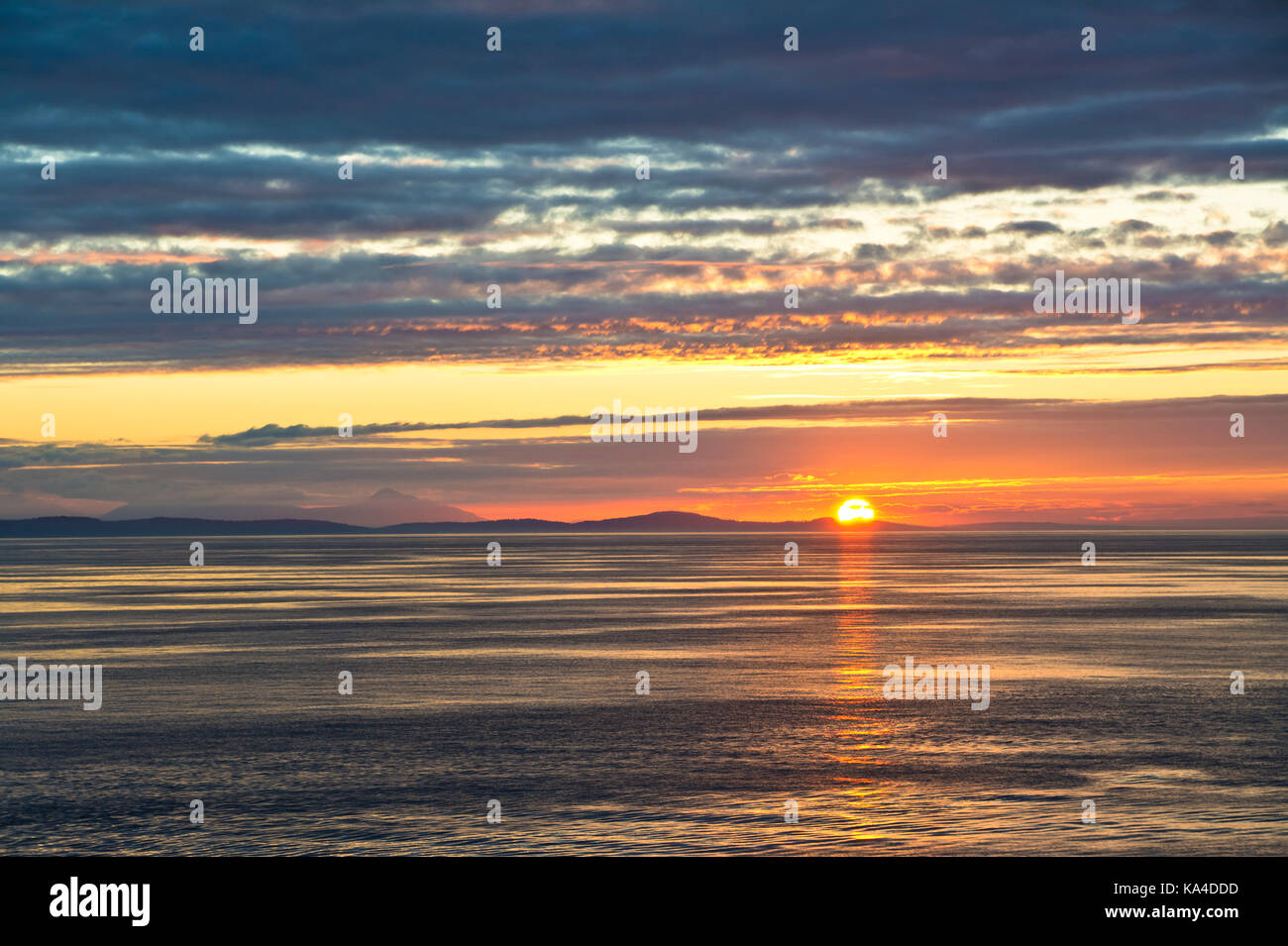 Gorgeous sunset on the Strait pf Georgia, near the Gulf Islands of British Columbia, as viewed from a BC Ferry. Stock Photo