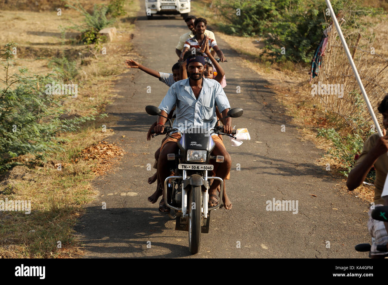 Indian family rides a motorbike Stock Photo