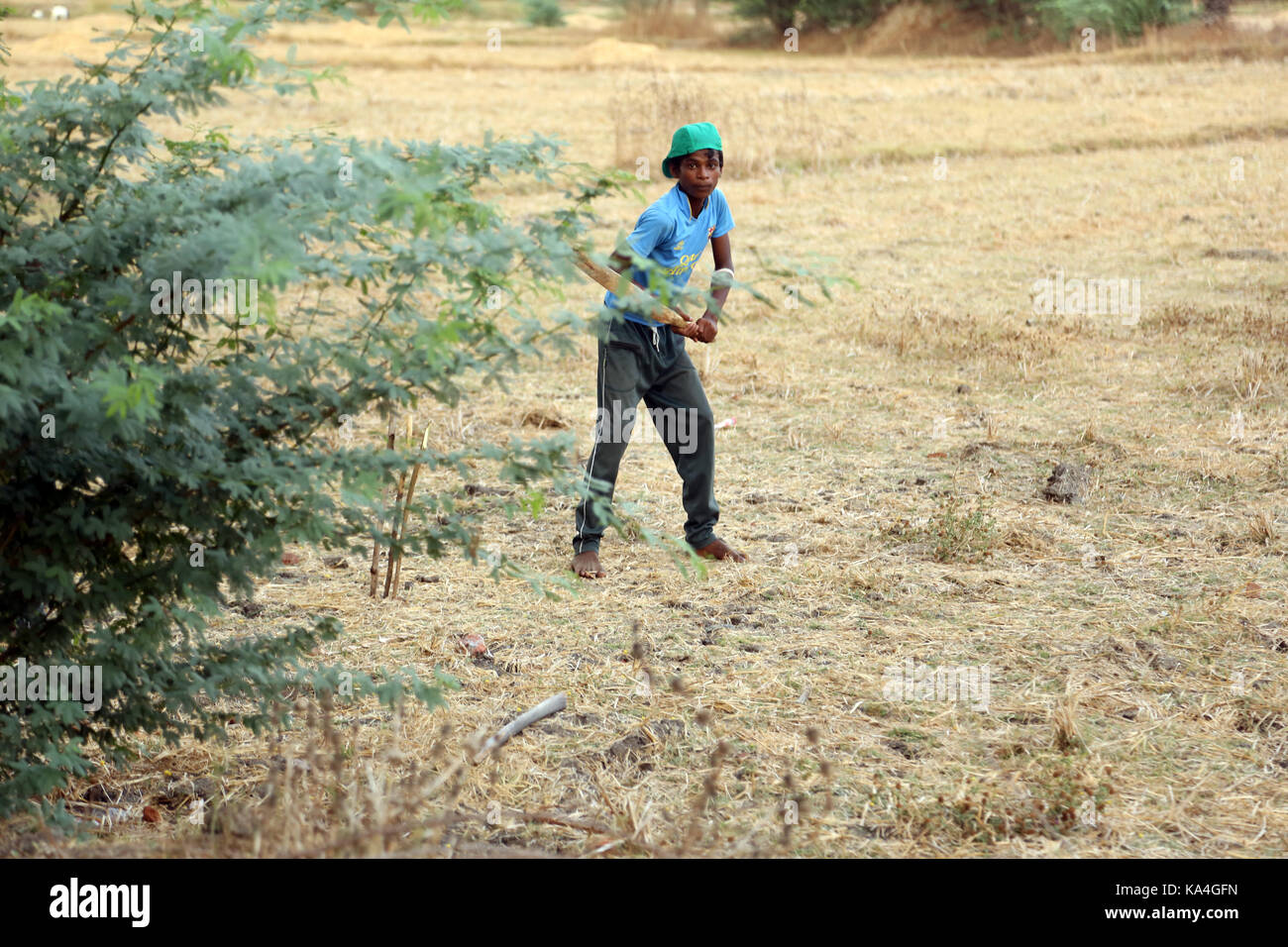 Rural village boys playing cricket Stock Photo