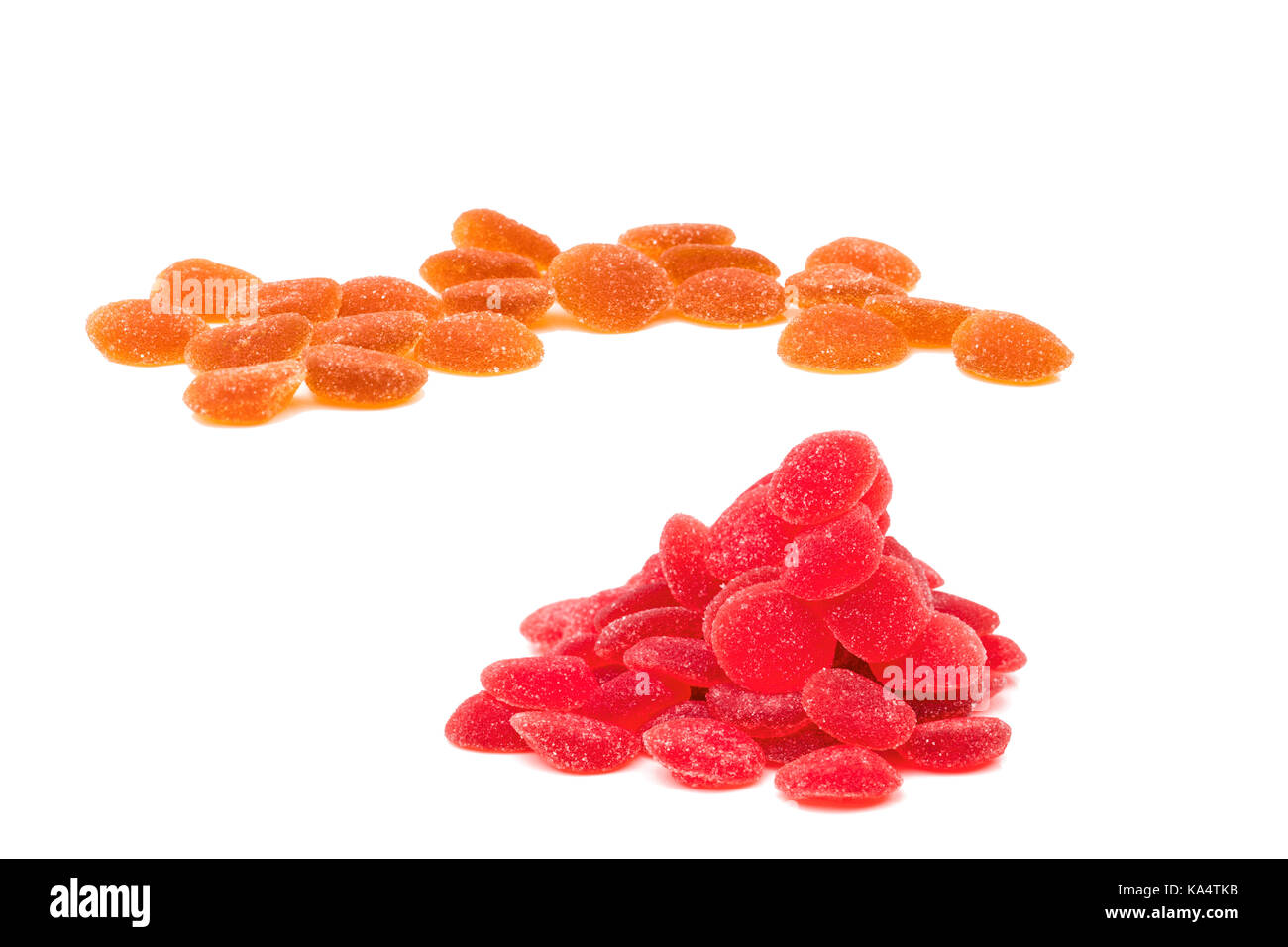 Pile of red and orange vitamin pastille with clipping path. Multivitamin gummy for kids to be healthy concept Stock Photo