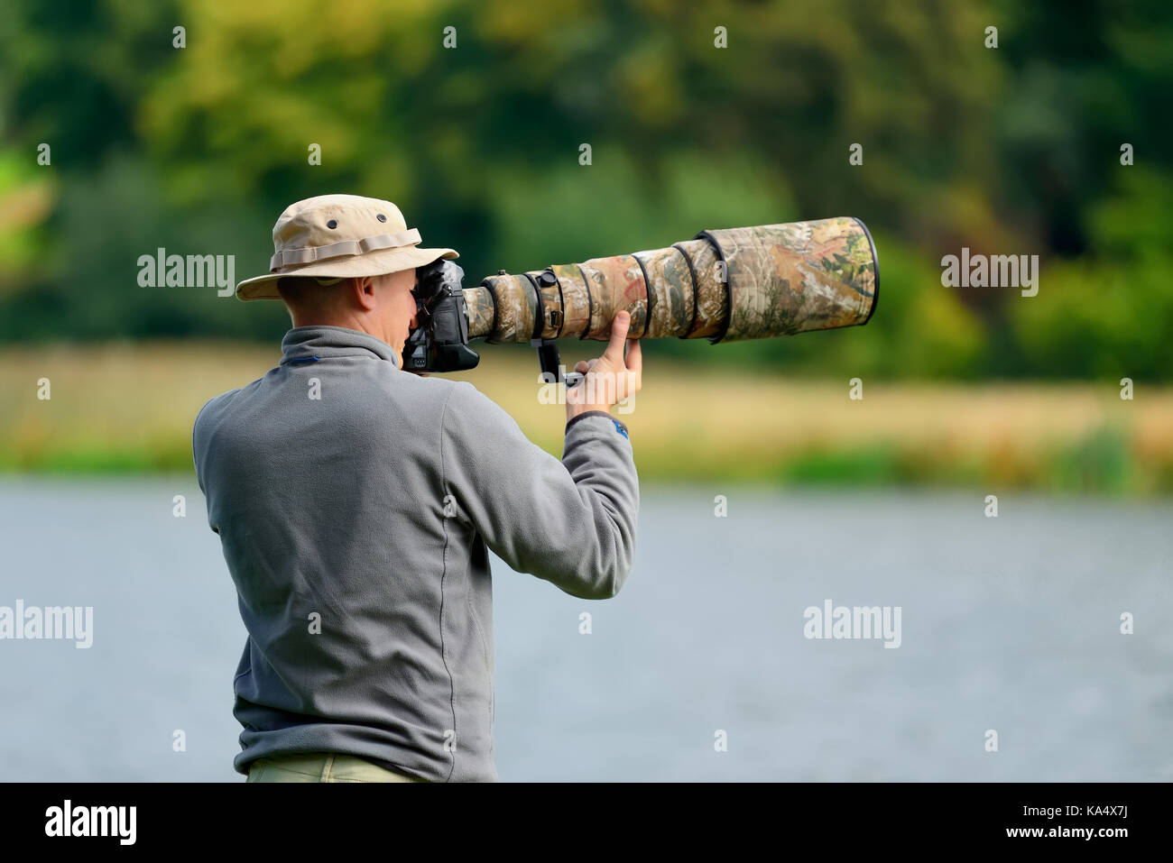 Professional wildlife photographer outdoor Stock Photo