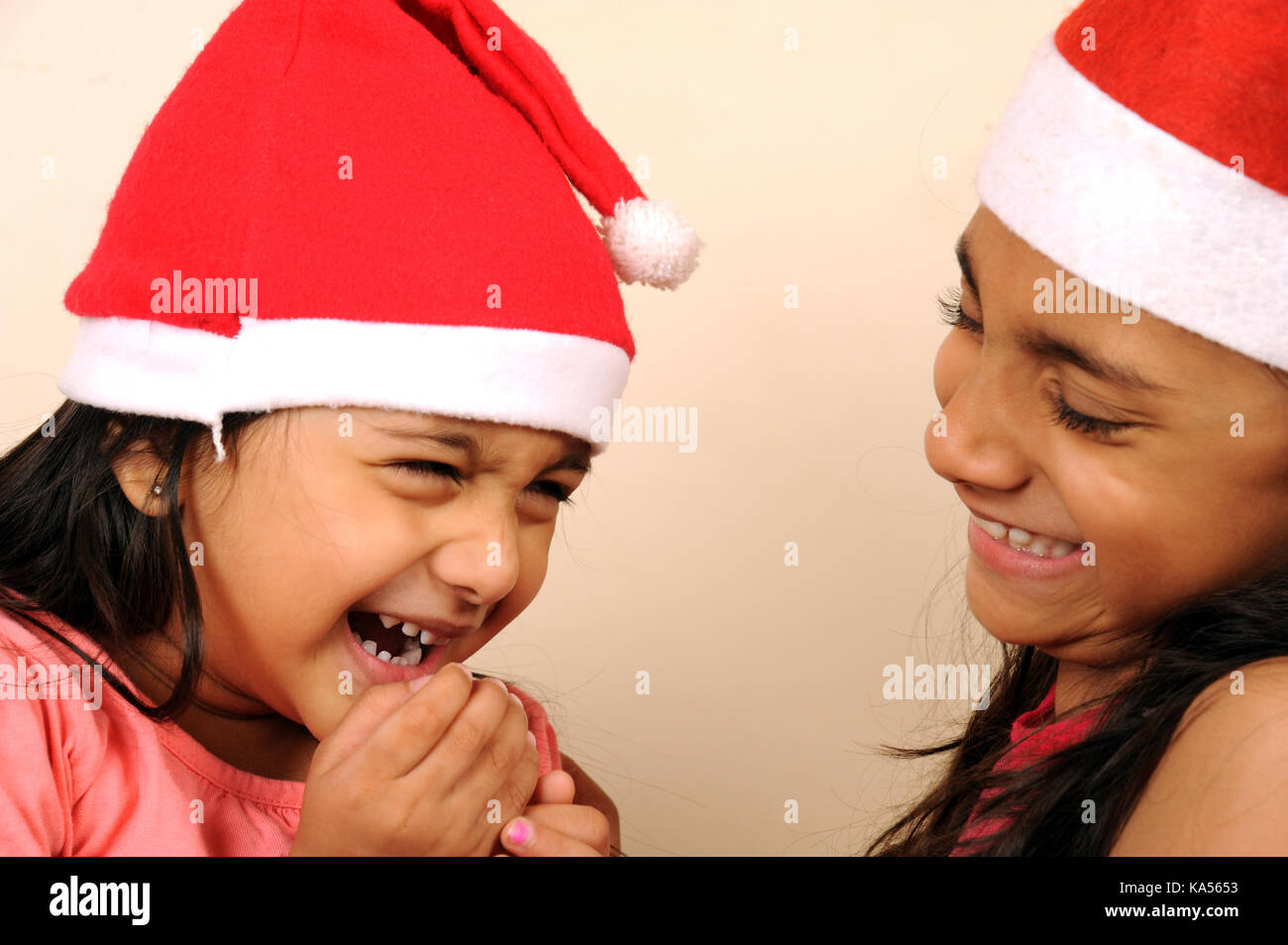 child girls wearing santa cap , India, Asia MR#736L, MR#736 LA Stock Photo