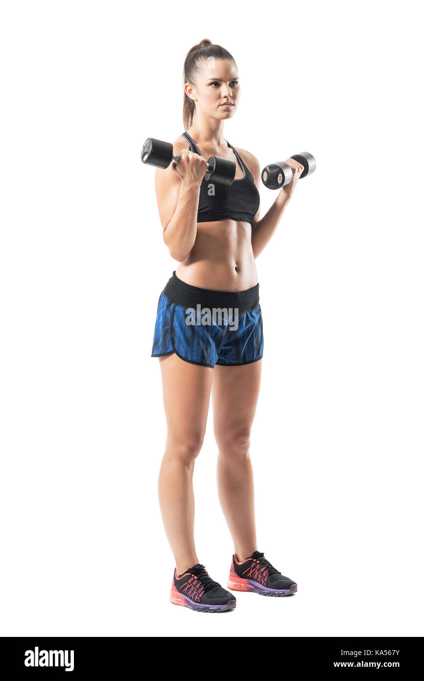 Tough muscular fit woman biceps workout exercise with dumbbell looking  away. Full body length portrait isolated on white studio background Stock  Photo - Alamy