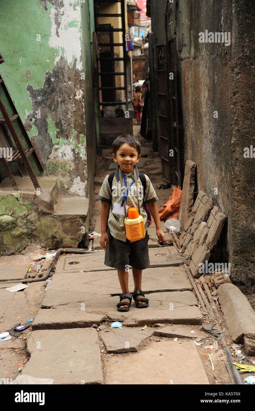 child school Boy in narrow lane, Dharavi, mumbai, maharashtra, India, Asia Stock Photo