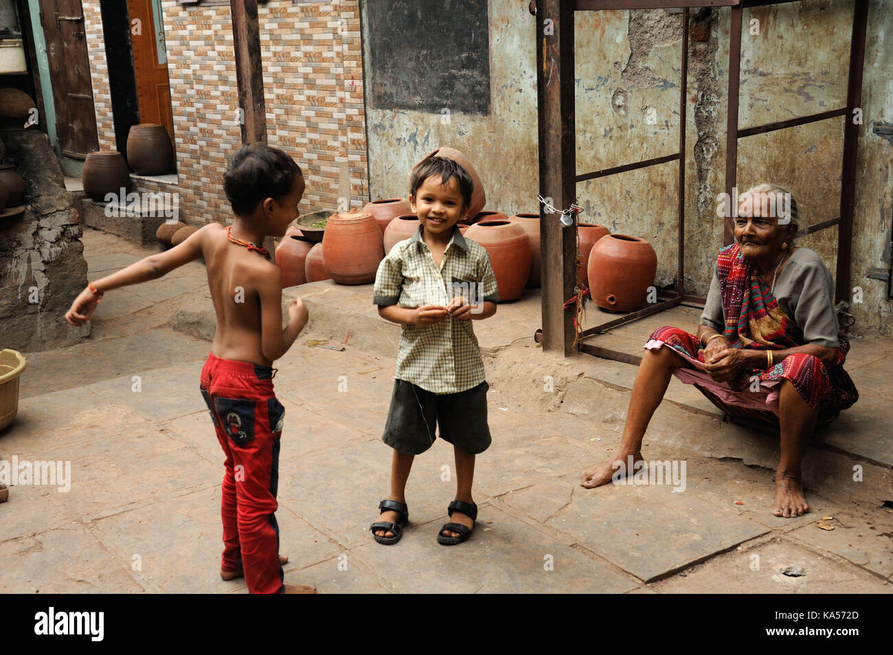 child playing dharavi slum, mumbai, maharashtra, India, Asia Stock Photo